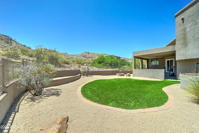 3903 E Melody Dr, Phoenix, AZ 85042 - view of yard with a ceiling fan, a patio area, and a mountain view