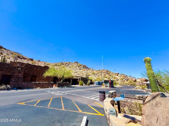 3903 E Melody Dr, Phoenix, AZ 85042 - view of asphalt road featuring a mountain view and curbs