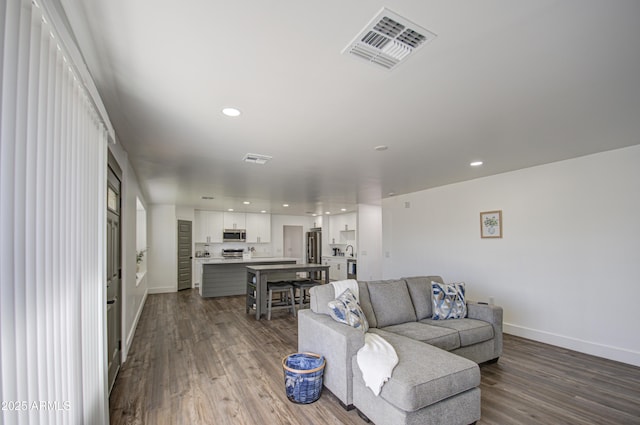 living room featuring wood-type flooring