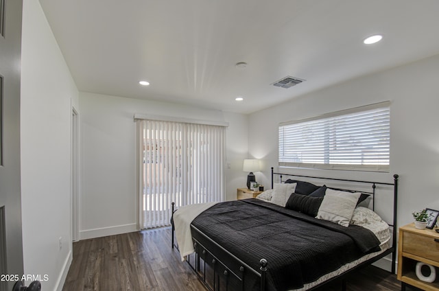 bedroom featuring dark hardwood / wood-style flooring