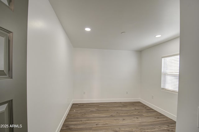 spare room featuring dark hardwood / wood-style flooring