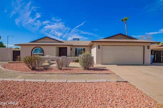 ranch-style home featuring a garage