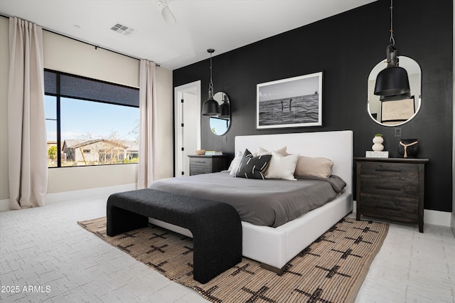 bedroom with visible vents and baseboards