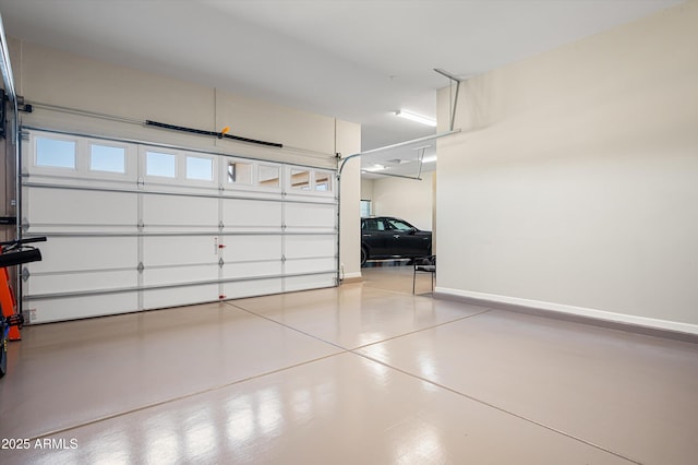 garage featuring baseboards