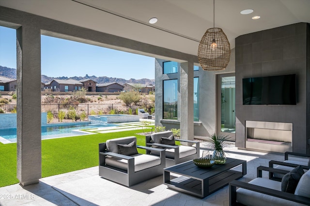 view of patio / terrace with a fenced in pool, outdoor lounge area, fence, and an in ground hot tub