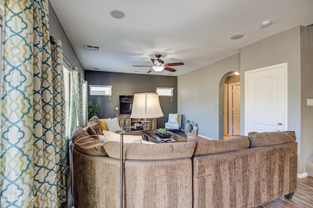 living room with ceiling fan and hardwood / wood-style floors