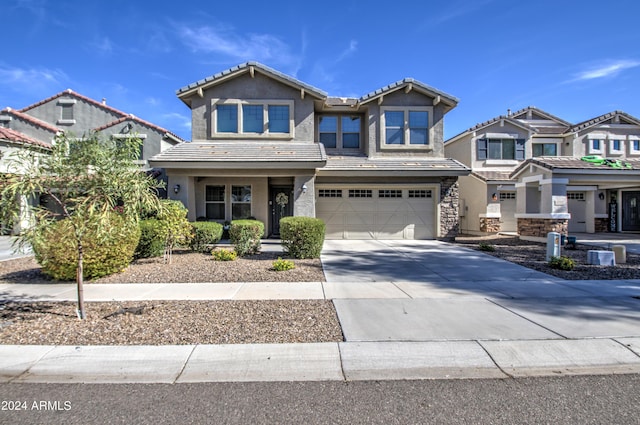 4196 E Bonanza Rd, Gilbert, AZ 85297 - craftsman-style home featuring a tiled roof, stucco siding, an attached garage, concrete driveway, and stone siding