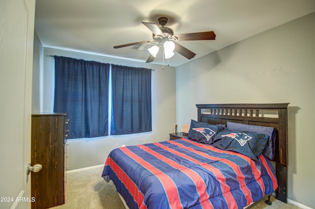 bedroom with light carpet and ceiling fan