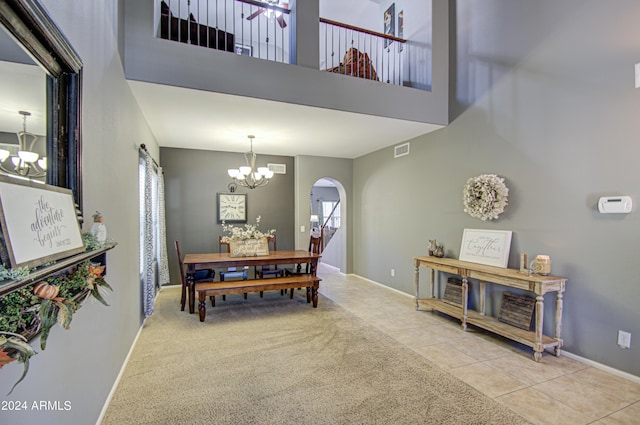 4196 E Bonanza Rd, Gilbert, AZ 85297 - dining room featuring a high ceiling, tile patterned floors, visible vents, arched walkways, and a chandelier