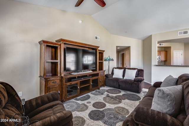 living room with vaulted ceiling, hardwood / wood-style floors, and ceiling fan