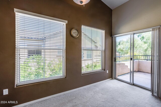 unfurnished room featuring carpet flooring and baseboards