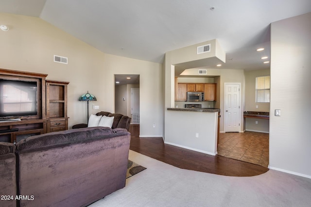 carpeted living room featuring recessed lighting, visible vents, and vaulted ceiling