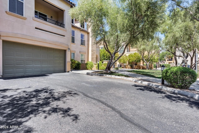 view of road with a residential view and curbs