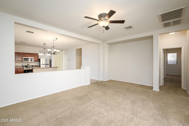 unfurnished living room with ceiling fan with notable chandelier and light colored carpet