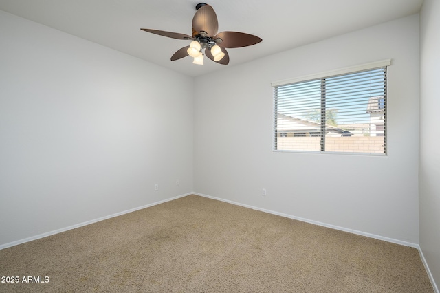 empty room featuring ceiling fan and carpet floors