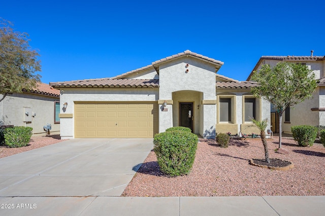 mediterranean / spanish-style home with a garage