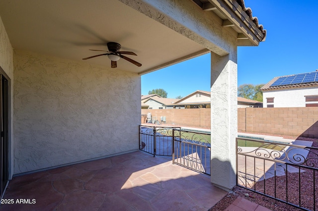 view of patio with ceiling fan