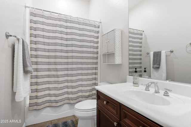 full bathroom featuring toilet, shower / bath combo, and vanity