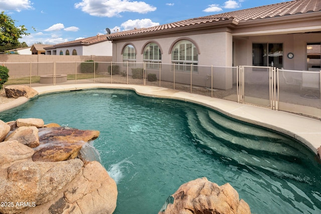 view of swimming pool featuring a fenced in pool, a patio area, and a fenced backyard