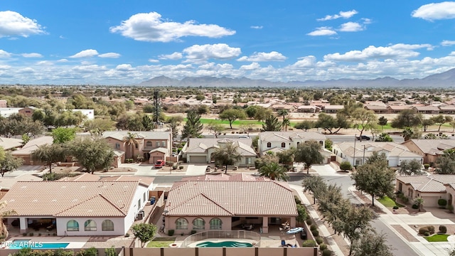 drone / aerial view featuring a mountain view and a residential view