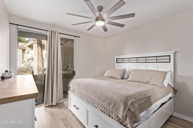 bedroom featuring ceiling fan, light hardwood / wood-style flooring, and access to outside