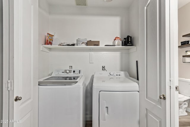 washroom with washing machine and dryer