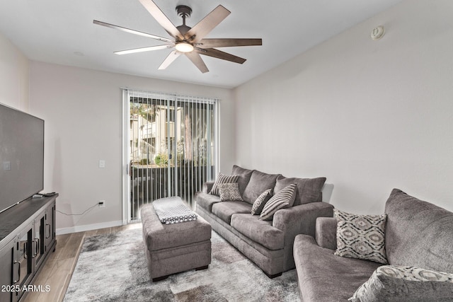 living room with hardwood / wood-style flooring and ceiling fan