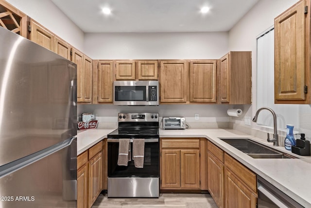 kitchen featuring stainless steel appliances and sink