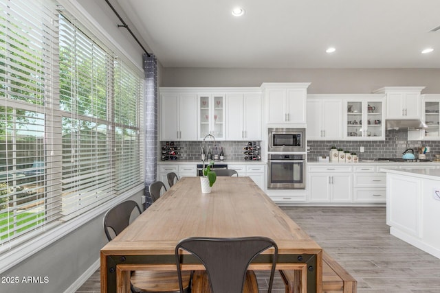 1342 E Milada Dr, Phoenix, AZ 85042 - kitchen featuring stainless steel appliances, light countertops, backsplash, and recessed lighting