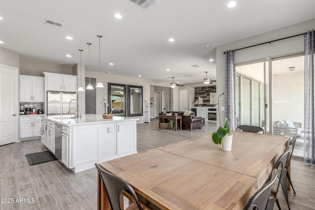 1342 E Milada Dr, Phoenix, AZ 85042 - dining room with ceiling fan, recessed lighting, and light wood finished floors