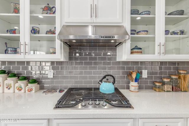 1342 E Milada Dr, Phoenix, AZ 85042 - kitchen with exhaust hood, stainless steel gas cooktop, white cabinets, and glass insert cabinets