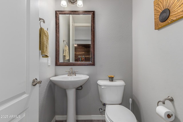 1342 E Milada Dr, Phoenix, AZ 85042 - bathroom featuring toilet and baseboards
