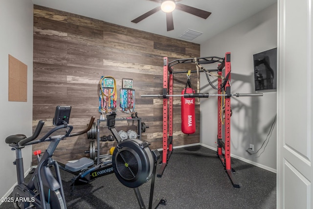 1342 E Milada Dr, Phoenix, AZ 85042 - exercise area with wood walls, a ceiling fan, and baseboards