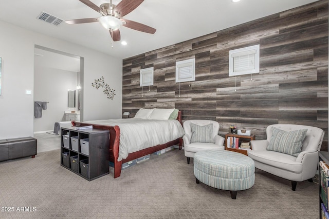 1342 E Milada Dr, Phoenix, AZ 85042 - bedroom with an accent wall, carpet flooring, wooden walls, recessed lighting, and ensuite bath