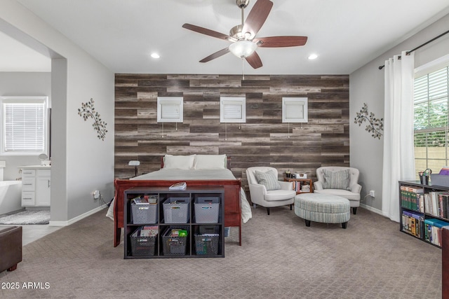 1342 E Milada Dr, Phoenix, AZ 85042 - living area with an accent wall, ceiling fan, recessed lighting, carpet, and wood walls