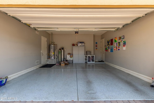1342 E Milada Dr, Phoenix, AZ 85042 - garage featuring water heater, baseboards, and a garage door opener