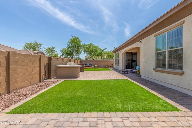1342 E Milada Dr, Phoenix, AZ 85042 - view of yard featuring an outdoor kitchen and a patio