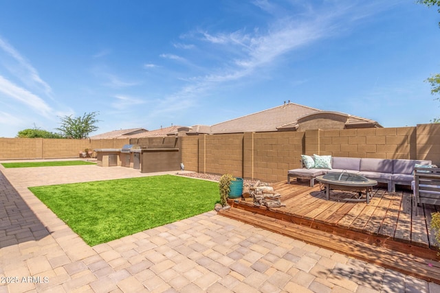 1342 E Milada Dr, Phoenix, AZ 85042 - view of patio featuring an outdoor kitchen, a deck, and an outdoor living space with a fire pit