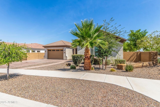 1342 E Milada Dr, Phoenix, AZ 85042 - view of front of house with concrete driveway, a garage, and stucco siding