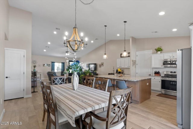 dining area featuring baseboards, high vaulted ceiling, light wood-style flooring, recessed lighting, and a chandelier