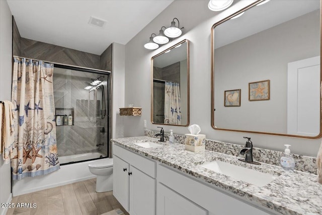 bathroom with double vanity, shower / tub combo, visible vents, and a sink