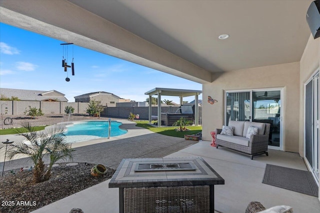 view of swimming pool featuring a patio area, a fenced in pool, outdoor lounge area, and a fenced backyard