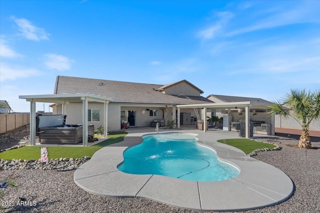 view of pool with a fenced in pool, a patio area, fence, and a hot tub