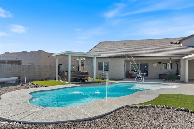 view of pool with a patio area, a fenced in pool, a hot tub, and a fenced backyard