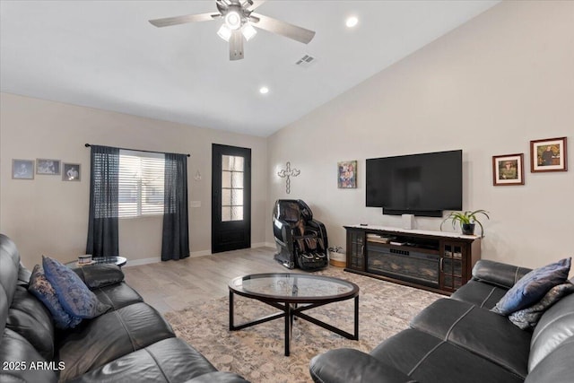 living room featuring a ceiling fan, baseboards, visible vents, recessed lighting, and vaulted ceiling