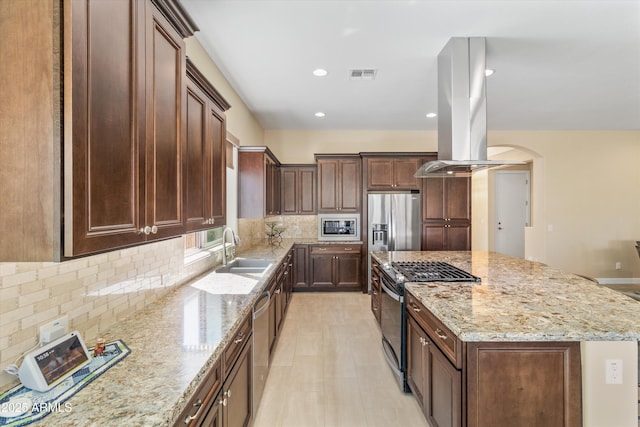 644 E Las Puertas Ln, Queen Creek, AZ 85140 - kitchen with visible vents, a sink, appliances with stainless steel finishes, island exhaust hood, and a kitchen island