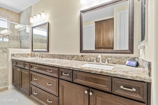 644 E Las Puertas Ln, Queen Creek, AZ 85140 - full bathroom featuring a shower stall, double vanity, a sink, and a healthy amount of sunlight