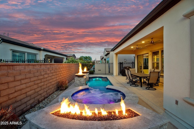 644 E Las Puertas Ln, Queen Creek, AZ 85140 - view of swimming pool featuring a patio area, a fenced backyard, a fenced in pool, and a fire pit