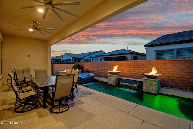 644 E Las Puertas Ln, Queen Creek, AZ 85140 - view of patio with a fenced backyard, ceiling fan, a pool with connected hot tub, and outdoor dining area