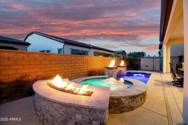 644 E Las Puertas Ln, Queen Creek, AZ 85140 - view of swimming pool featuring a patio area, a fenced backyard, a fenced in pool, and a fire pit